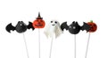 Different Halloween themed cake pops on background