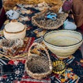 Different hand made weave basckets on table. Craft workshop. Close up shot Royalty Free Stock Photo