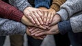 Collaborative hands uniting for a cause community space group activity natural light elevated perspective togetherness concept Royalty Free Stock Photo