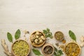 Different herbs in bowls on wooden background, top view Royalty Free Stock Photo