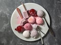 Different homemade ice cream scoops over a plate. Generative AI