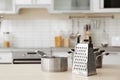 Houseware and blurred view of kitchen interior on background Royalty Free Stock Photo