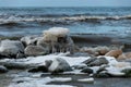 different ice formations on rocks on the seashore, ice texture, wind, water and ice working together Royalty Free Stock Photo