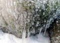 different ice formations on rocks on the seashore, ice texture, wind, water and ice working together Royalty Free Stock Photo