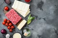 Different ingredients for lasagna, on gray stone background, top view, flat lay, with copy space for text Royalty Free Stock Photo