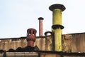 Different kind of chimneys on the rooftop