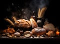 Different kind of natural breads. Fresh loafs of bread in the blue basket with ears of rye and wheat on a black