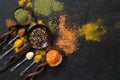 Different kind of spices on a black stone. Royalty Free Stock Photo