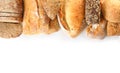 Different kinds of bread on white, top view Royalty Free Stock Photo