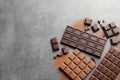 Different kinds of chocolate on grey background, flat lay Royalty Free Stock Photo