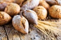 Different kinds of fresh bread on wooden table. assortment of bread on brown background Royalty Free Stock Photo