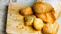 Different kinds of fresh bread on wooden table. Isolated assortment of bread on brown background. Slider shooting Royalty Free Stock Photo