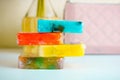 Four colorful pieces of handmade natural soap. Light blurred background. Red, blue, yellow and green colors Royalty Free Stock Photo