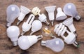 Different kinds of light bulbs on wooden background Royalty Free Stock Photo
