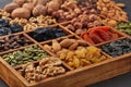 Different kinds of nuts, dried fruits in wooden box. Healthy food. Vegetarian nutrition Royalty Free Stock Photo