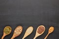 Different kinds of nuts and seeds on black slate background. Top view with copy space. Healthy food. Vegetarian nutrition Royalty Free Stock Photo