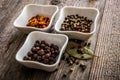 Different kinds of pepper in bowls Royalty Free Stock Photo