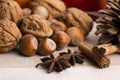 Different kinds of spices, nuts and dried oranges Royalty Free Stock Photo