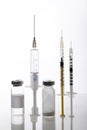 Different kinds of syringe,glass bottles of medicaments on the glass surface Royalty Free Stock Photo