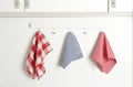 Different kitchen towels hanging on hook rack