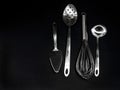 Different kitchen utensils on black Royalty Free Stock Photo