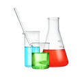 Different laboratory glassware with color liquid isolated on white Royalty Free Stock Photo