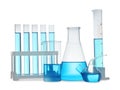 Different laboratory glassware with light blue liquid isolated on white Royalty Free Stock Photo