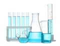 Different laboratory glassware with blue liquid isolated on white Royalty Free Stock Photo