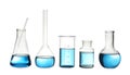 Different laboratory glassware with blue liquid isolated on white Royalty Free Stock Photo