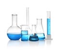 Different laboratory glassware with light blue liquid isolated Royalty Free Stock Photo