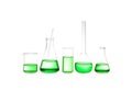 Different laboratory glassware with green liquid isolated on white Royalty Free Stock Photo