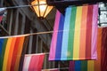 LGBTQ pride rainbow flags in row in city