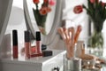 Different lip glosses on dressing table. Interior element Royalty Free Stock Photo