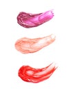 Different lip glosses, isolated Royalty Free Stock Photo