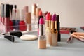 Lipsticks and different cosmetics on table Royalty Free Stock Photo