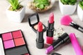 Different lipsticks and other cosmetics on table Royalty Free Stock Photo