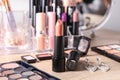 Different lipsticks and other cosmetics on table Royalty Free Stock Photo