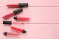 Different liquid lipsticks on table Royalty Free Stock Photo