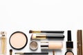 Different luxury makeup products on white, top view