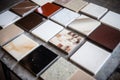 different marble tile samples spread on table Royalty Free Stock Photo