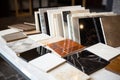 different marble tile samples spread on table Royalty Free Stock Photo