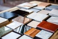 different marble tile samples spread on table Royalty Free Stock Photo