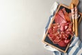 Different meat delicacies served on gray table, top view Royalty Free Stock Photo