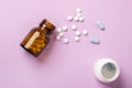 Different medications. Various pill bottles. One-color backdrop.