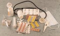 Different medications, vials, syringe, thermometer, mask, stethoscope