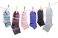 Different men`s and women`s socks on clothes line with clothespi