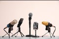 Different microphones on grey table. Journalist`s work