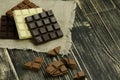 Dark , milk and white comemade chocolate factory background. Delicious chocolate pieces Royalty Free Stock Photo