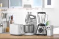 Different modern kitchen appliances on table indoors Royalty Free Stock Photo