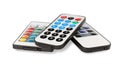 Different modern remote controls on white background